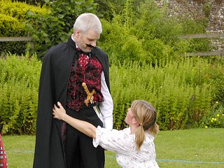 The drunkard's daughter pleads with the evil landlord