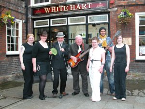 Photo of musicians outside pub